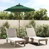 Two lounge chairs and an umbrella on a patio. Produktbild-Vorschau