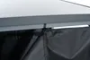 A close-up view of the top edge of a firewood storage rack with a black tarp attached. Produktbild-Vorschau
