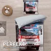 A bedding set featuring a fire truck design, displayed on a bed with a pillow and a woven basket nearby. Podgląd zdjęcia produktu