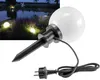 A garden scene at dusk with illuminated globe lights and a close-up of one of the lights with its plug. Produktbild-Vorschau