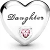 A close-up studio shot of a silver heart-shaped charm with the word "Daughter" engraved on it and a small pink heart-shaped gemstone in the center. Podgląd zdjęcia produktu
