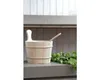 A wooden sauna bucket and ladle are placed on a shelf in a sauna. Produktbild-Vorschau