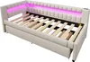 A beige upholstered daybed with a slatted wooden base and pink LED lighting along the headboard. Produktbild-Vorschau