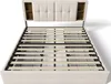 A bed frame with a slatted base and a padded headboard with built-in shelves. Náhled obrázku produktu