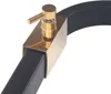 A close-up view of a shower faucet with a gold handle and a black body. Náhled obrázku produktu