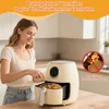 A woman is placing food into an air fryer, with marketing text and a warning symbol overlayed on the image. Produktbild-Vorschau