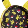 A close-up view of the inside lining of a yellow sequined backpack, featuring a pattern of Pikachu characters and Poké Balls. Náhled obrázku produktu