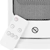 A close-up of a white remote control for a heater, resting on the heater itself. Voir les images du produit