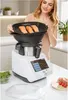 A woman is placing a steaming tray with salmon fillets into a multi-functional kitchen appliance. The appliance is white with a touchscreen display. Náhled obrázku produktu