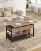 A lift-top coffee table is set up in a living room with plates and glasses, suggesting it's being used for dining. Voir les images du produit