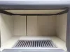 The interior of a wood-burning stove with a grate. Produktbild-Vorschau