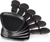 A stack of black raclette pans with handles, arranged diagonally against a white background. Produktbild-Vorschau