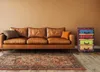 A living room scene with a leather sofa and a colorful chest of drawers. Podgląd zdjęcia produktu