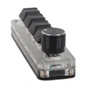 A close-up, angled view of a mini programmable keypad with black keycaps and a black rotary encoder. Náhled obrázku produktu