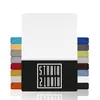 A stack of folded fabric swatches in various colors, with a large white sheet of fabric on top, and a black band with a logo at the bottom. Produktbild-Vorschau