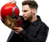 A man is holding an Iron Man helmet. Podgląd zdjęcia produktu