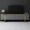 A modern TV stand with a television on top, set against a dark gray wall. Anteprima dell’immagine prodotto