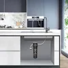 A cutaway view of a kitchen sink cabinet showing an under-sink water filter system. Produktbild-Vorschau