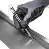 A gloved hand is using a Pica Dry marker and scriber to mark a metal surface. Náhľad obrázku produktu