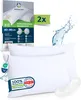 Two white pillows are shown, with packaging and marketing elements in the background. Podgląd zdjęcia produktu