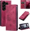 Collage of images showing a magenta phone case with a dandelion design, including the case open, closed, and a phone inside. Produktbild-Vorschau