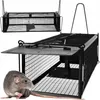 A live trap for rodents is shown with a rat in the foreground. Voir les images du produit