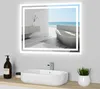 A modern bathroom sink with a mirror reflecting a serene beach scene.