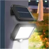A solar-powered outdoor light with a motion sensor is mounted on a wall, illuminating the surrounding garden area at night. Anteprima dell’immagine prodotto