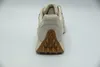 The back view of a beige Skechers sneaker is shown against a white background. Produktbild-Vorschau