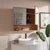 A modern bathroom vanity with a medicine cabinet above a sink. Produktbild-Vorschau