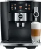 A JURA coffee machine is shown with a latte being dispensed into a glass. Produktbild-Vorschau