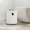 A white towel warmer is placed next to a bathtub in a bathroom. Anteprima dell’immagine prodotto