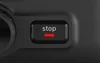 A close-up of a black button with the word "stop" and a red line underneath, likely on an appliance. Produktbild-Vorschau