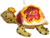 A glass Christmas ornament shaped like a turtle wearing a hat and decorated with a flower. Podgląd zdjęcia produktu