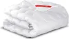 A folded white duvet with a red label. Náhled obrázku produktu