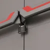 A close-up view of a locked storage cabinet door, showing the locking mechanism and decorative red accents. Voir les images du produit
