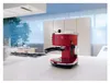 A red DeLonghi espresso machine sits on a white kitchen counter. Podgląd zdjęcia produktu