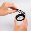 Hands holding two parts of a reusable coffee filter. Produktbild-Vorschau