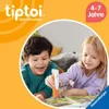 Two children are playing with a tiptoi pen and a book. Anteprima dell’immagine prodotto