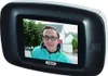 A digital door viewer showing a person's face on its screen. Produktbild-Vorschau