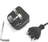 A black electrical plug adapter and a silver L-shaped hex key are laid out on a white background. Podgląd zdjęcia produktu