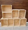 A stack of empty wooden crates against a wooden background. Produktbild-Vorschau