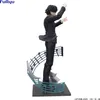 A figurine of a person in a suit conducting, with musical notes as part of the base. Produktbild-Vorschau
