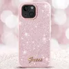 A close-up shot of a pink glittery phone case with the Guess logo. Produktbild-Vorschau