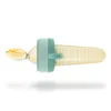 A baby food feeder with a spoon attached, filled with yellow puree. Anteprima dell’immagine prodotto