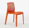 An orange plastic chair with a patterned seat and backrest is shown against a white background. Produktbild-Vorschau