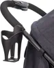 A close-up view of a stroller handle with a cup holder attached. Produktbild-Vorschau