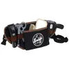 A toy barber set worn as a belt, containing various barber tools. Produktbild-Vorschau