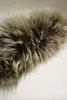 A close-up view of a fluffy, textured material, likely faux fur or real fur, in shades of brown and beige. Produktbild-Vorschau
