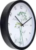 A black wall clock with a botanical illustration of dill on its face. Náhled obrázku produktu
